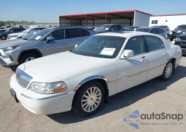 1LNHM82W03Y614572: 42221572