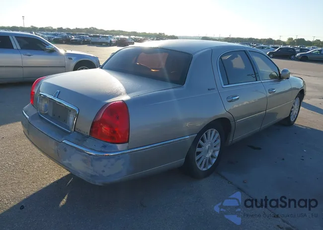 1LNHM82W33Y704279: 43391044