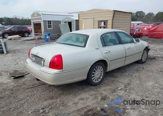 1LNHM82W65Y603885: 44309574